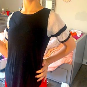 A black t shirt with glittery tool sleeve